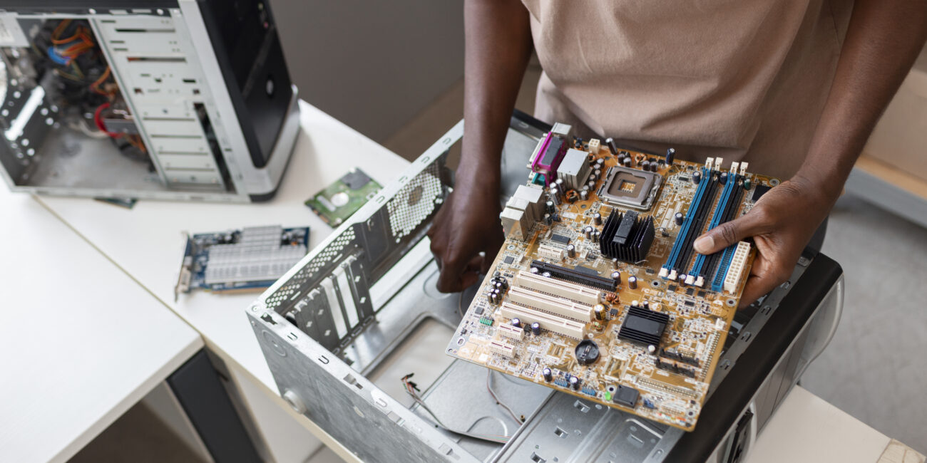 close up man repairing computer chips